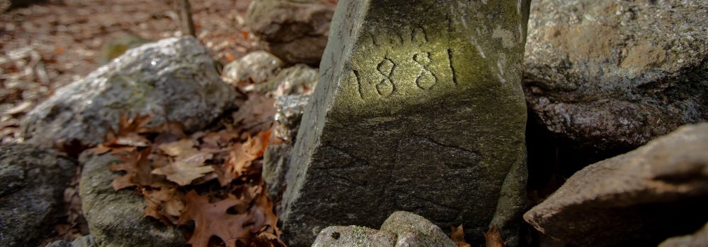Stones with dates chiseled into them mark the location of a long gone chestnut tree that marks the border of Bethany, Prospect and Naugatuck.