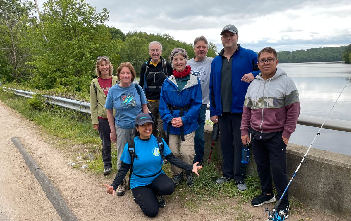 a group of people standing in front of Shenipsit lake